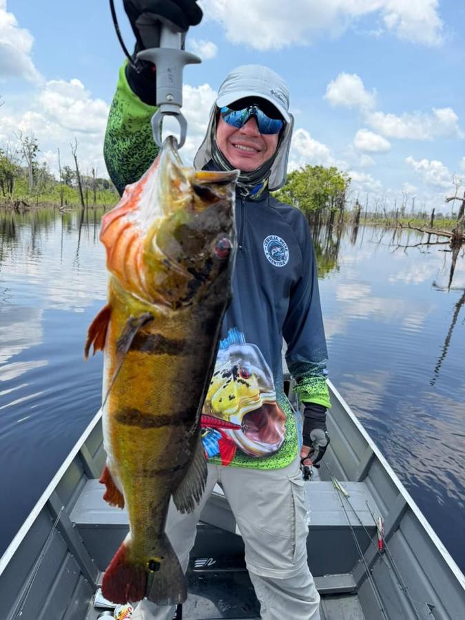 Peacock bass catch on a cloudy day on the river