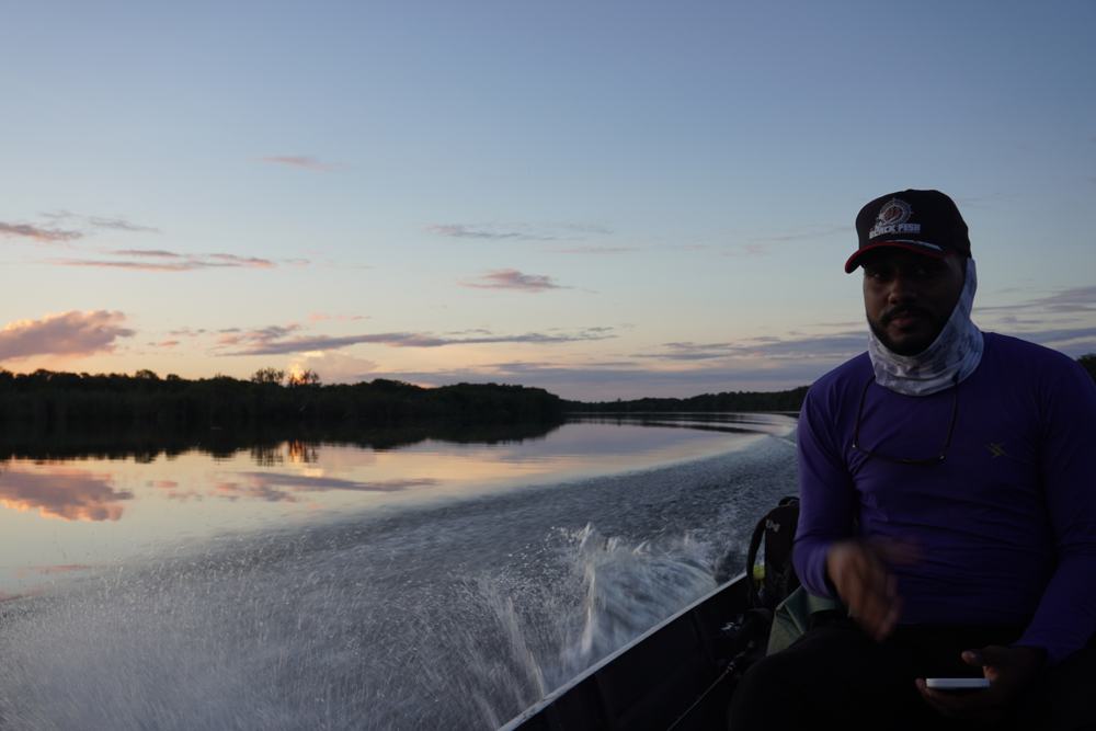Glassy dawn water on the morning run to the fishing grounds