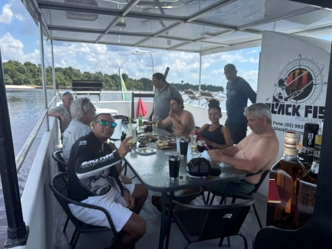 Guests enjoying drinks on the boat deck