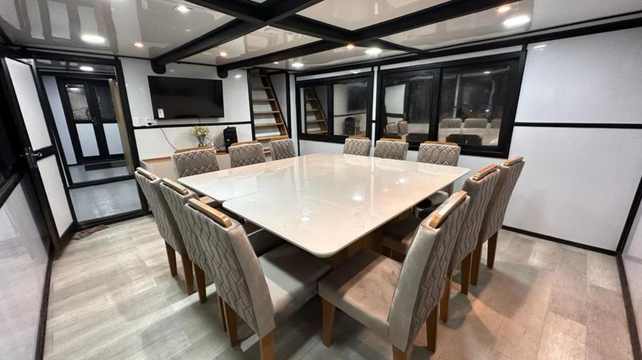 Air-conditioned dining room aboard the MotherShip floating lodge